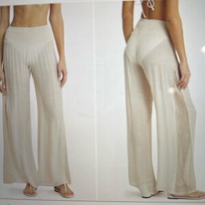 White Crochet trimmed side leg cover up pants. 50% acrylic, 50% Viscose